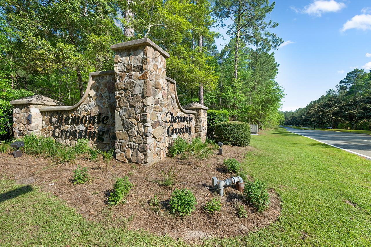 Chemonie Crossing neighborhood entrance sign in Tallahassee, Florida, made of rock