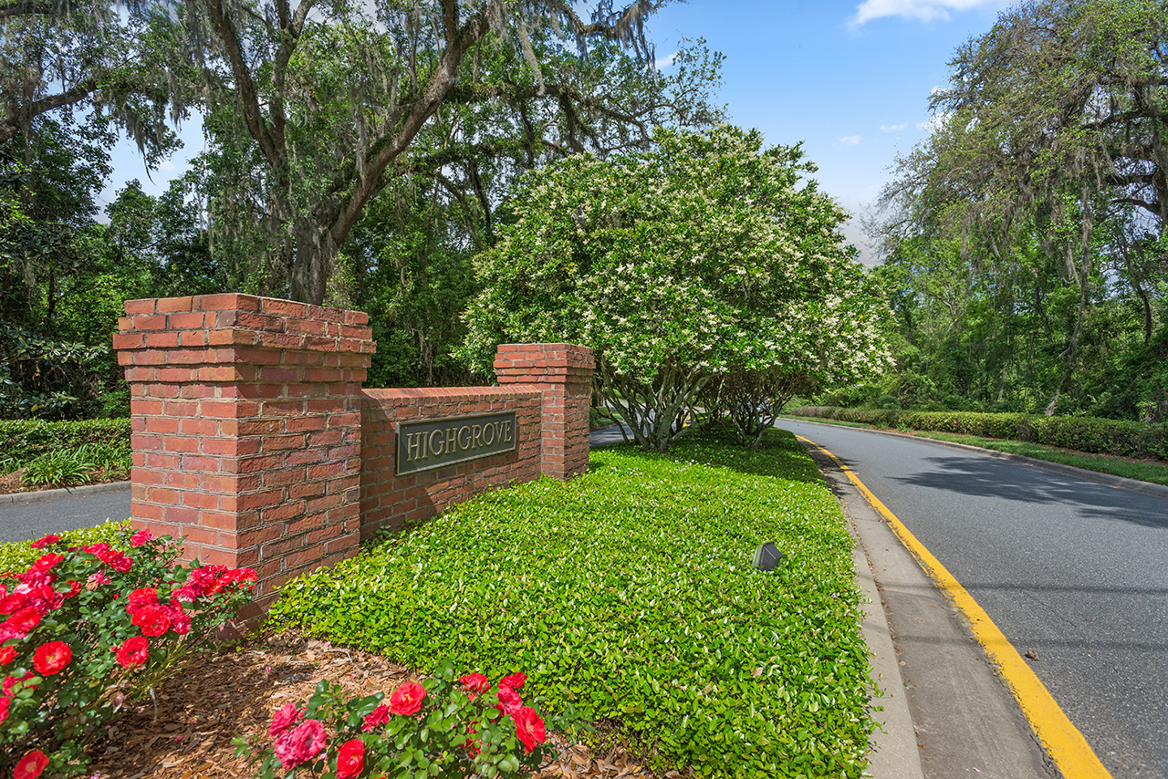 Highgrove neighborhood entrance sign in red brick, on a sunny summer day