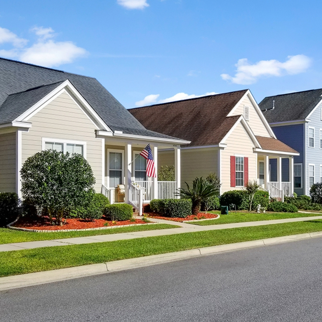 Row of homes in Southwood Tallahassee neighborhood on a blue sky day