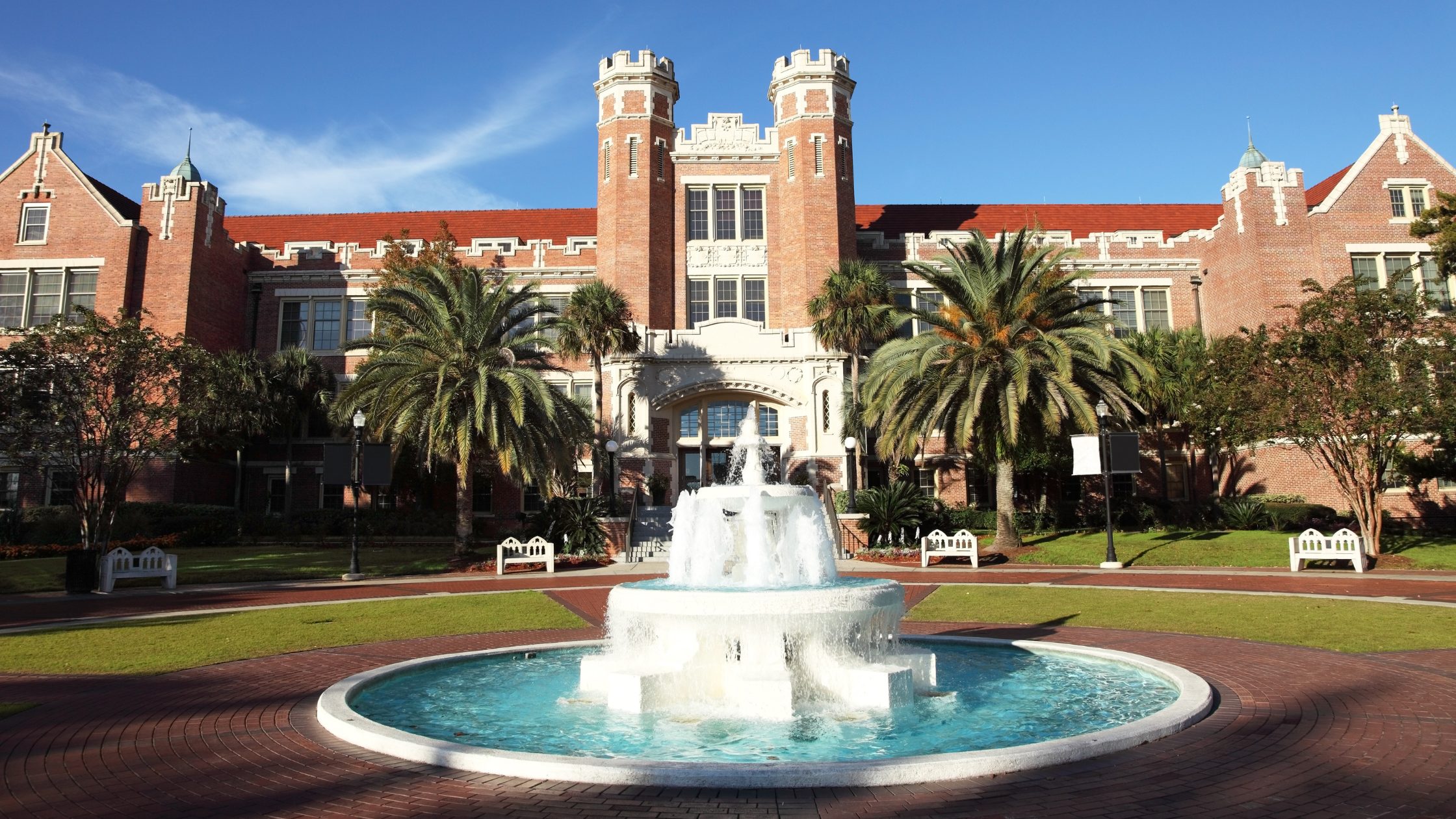 Stock photo of the Westcott Fountain at Florida State University in Tallahassee, Florida. The photo is take in front of the Westcott fountain and building with clear blue skies in the background.