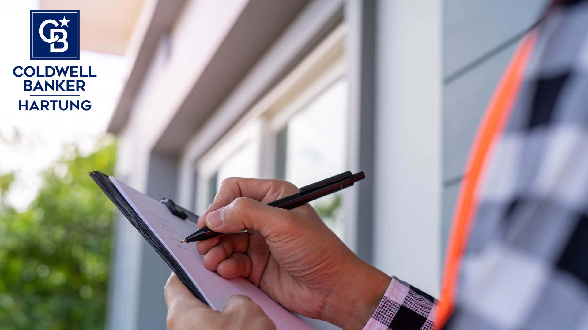 Home inspector writing up a report