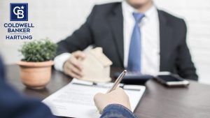 Buyer signing paperwork for mortgage